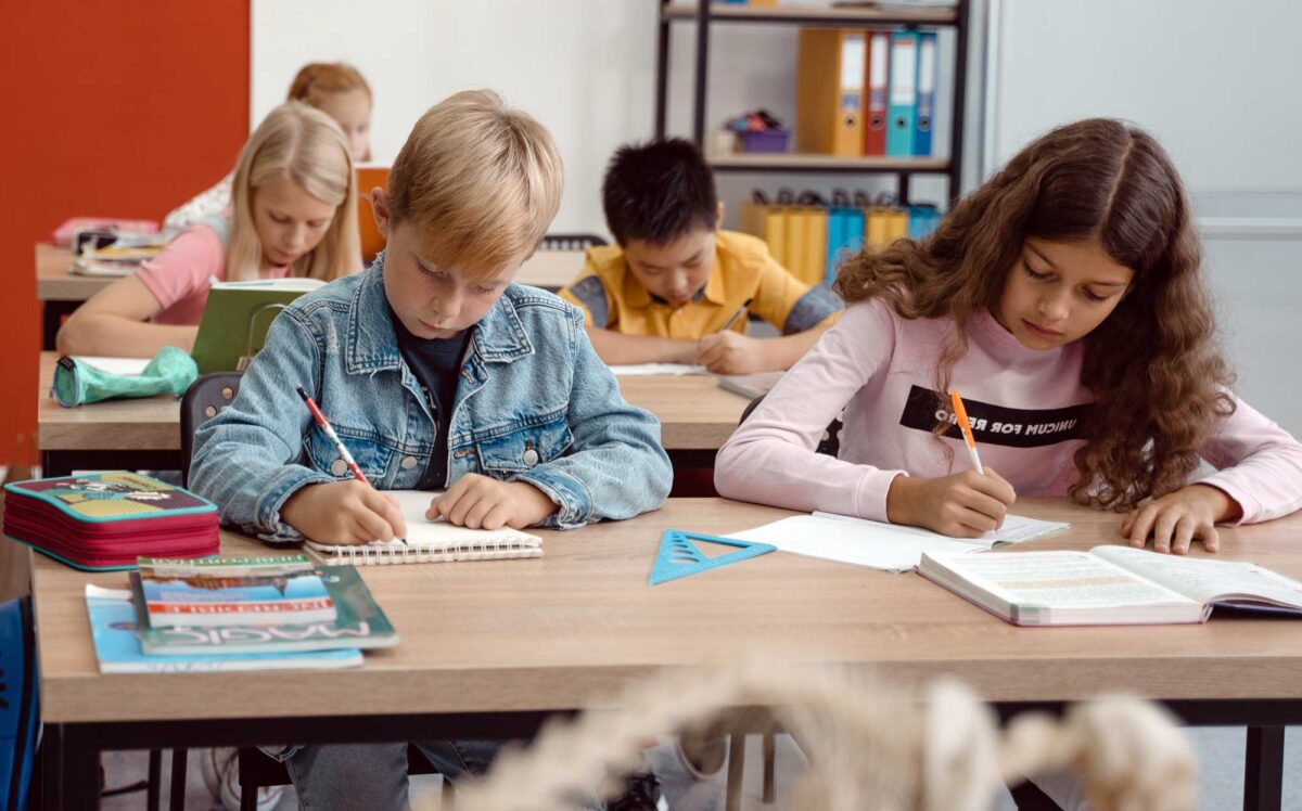 Children working at their desks during a lesson